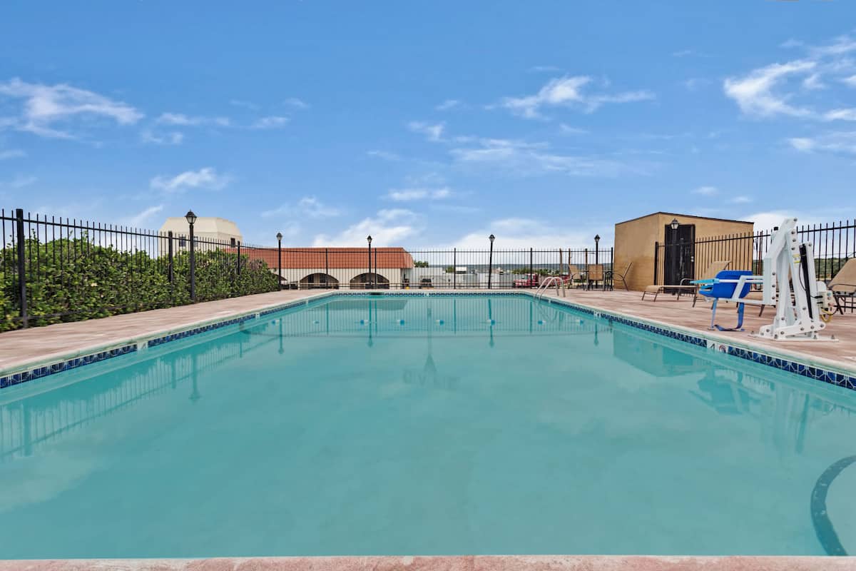 Seasonal outdoor pool at Days Inn & Suites by Wyndham Santa Rosa
